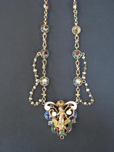 Appraisal: AN ART NOUVEAU ENAMELLED PENDANT modelled as Leder and the