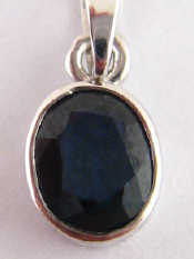 Appraisal: A white metal tests carat gold sapphire pendant drop approx