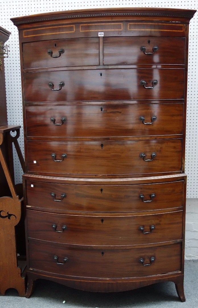 Appraisal: An early th century inlaid mahogany bowfront chest of two