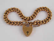 Appraisal: A carat rose gold curb link bracelet with heart padlock