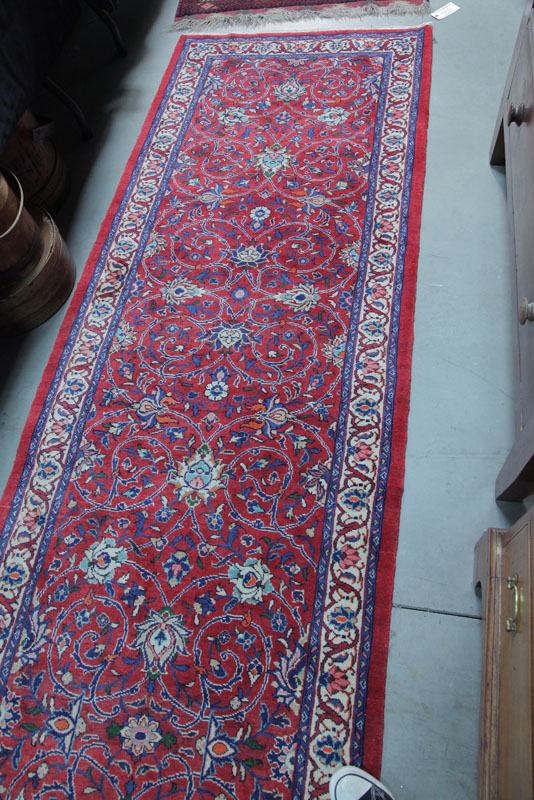 Appraisal: ORIENTAL RUNNER Floral motif in shades of red and cream