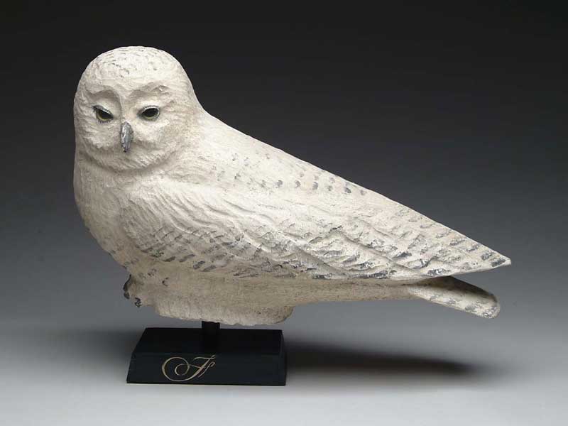 Appraisal: CARVED AND PAINTED SNOWY OWL BY FRANK FINNEY Large perched