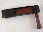 Appraisal: A metal framed heavy hardwood warning rattle probably c