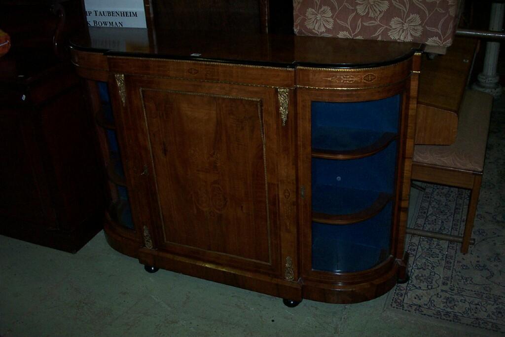 Appraisal: A Victorian walnut D-end credenza the central door with marquetry