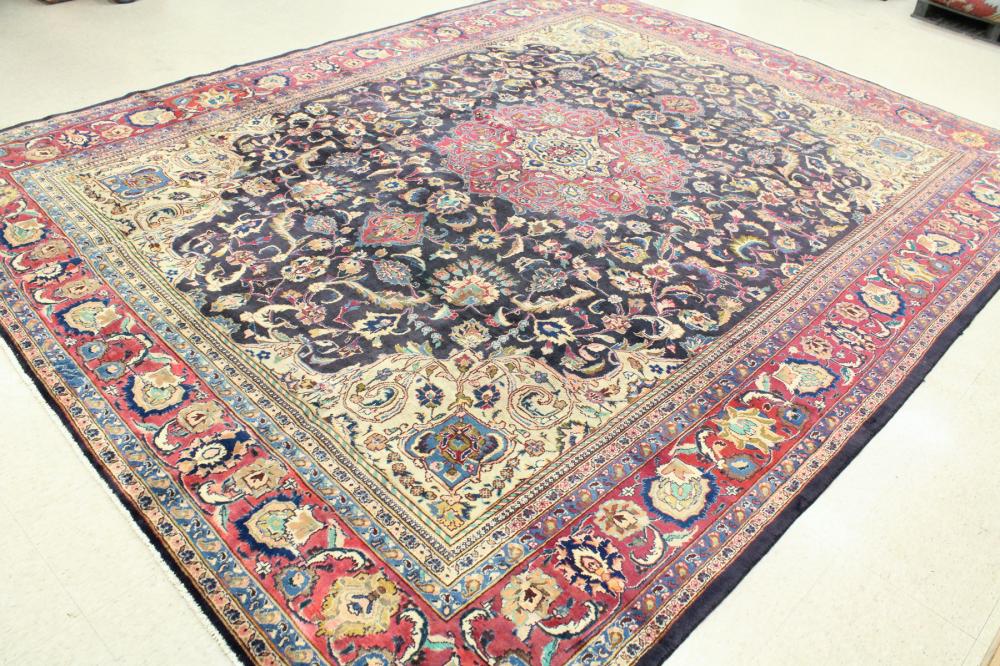 Appraisal: SEMI-ANTIQUE PERSIAN CARPET floral and central floral medallion design on