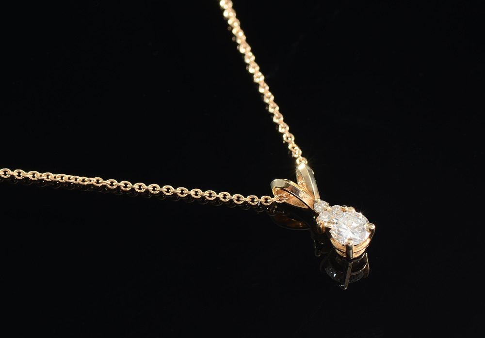 Appraisal: DIAMOND PENDANT NECKLACE K yellow gold pendant and chain The