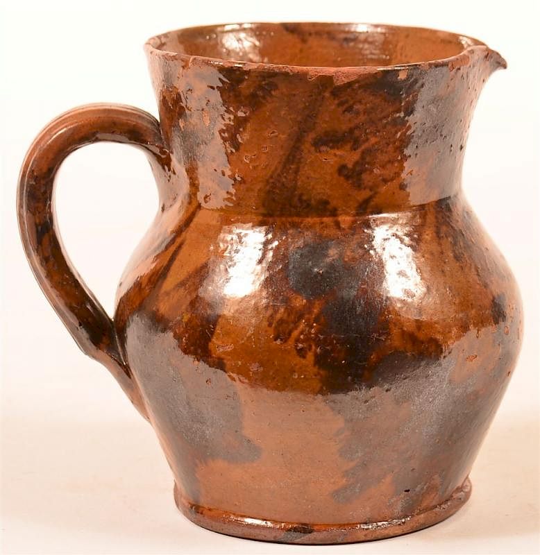 Appraisal: Mottle Glazed Redware Pottery Cream Pitcher th Century Mottle Glazed