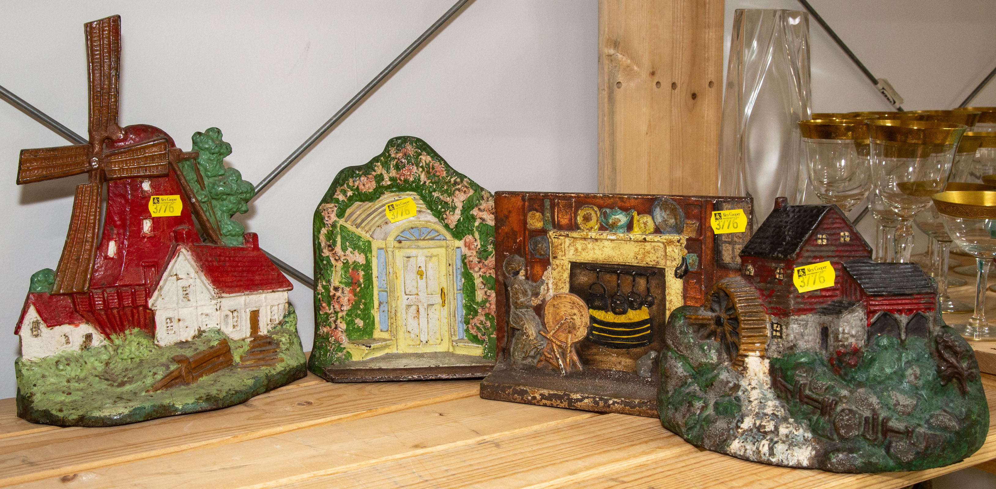 Appraisal: FOUR PAINTED CAST IRON DOOR STOPS Early th century including