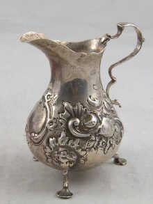 Appraisal: A Victorian silver cream jug with embossed decoration hallmarked London