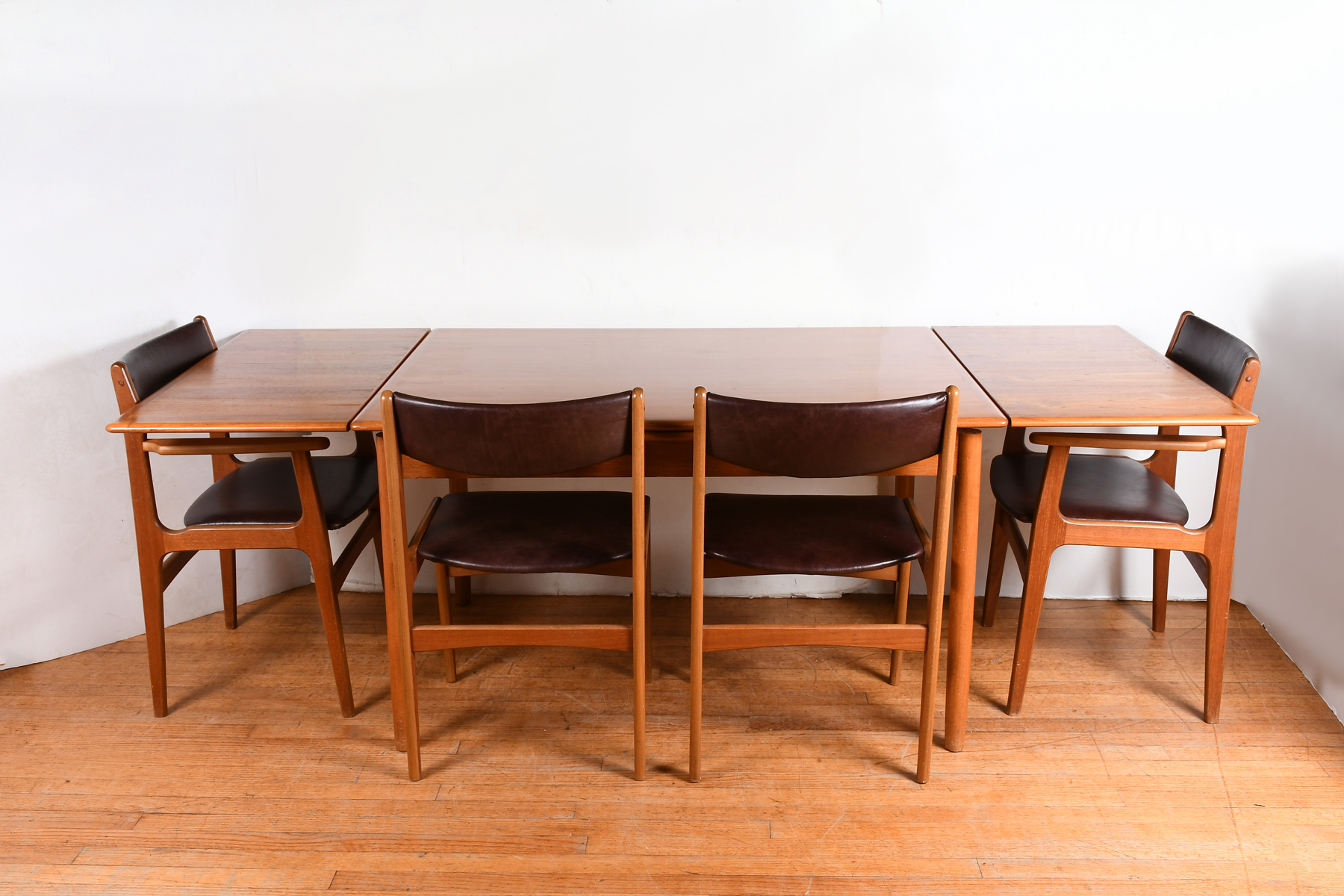 Appraisal: DANISH MID-CENTURY MODERN DINING TABLE CHAIRS Comprising - Danish dining