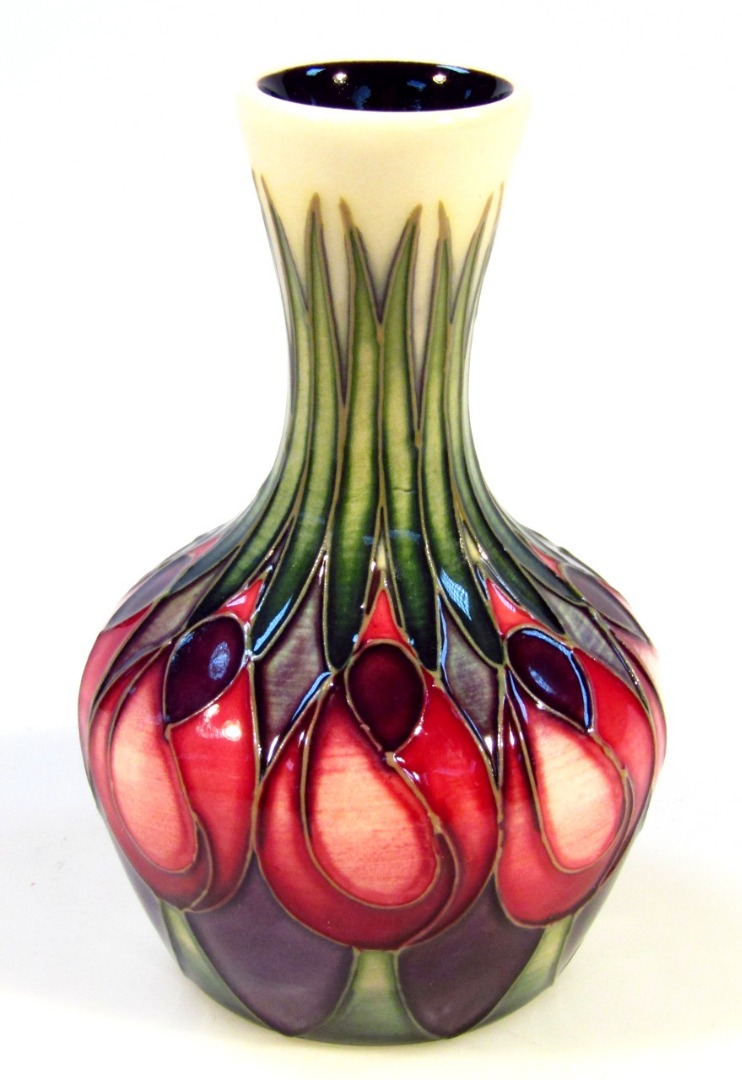 Appraisal: A Moorcroft pottery April Tulip vase by Emma Bossons of