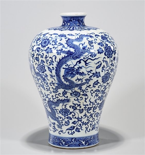 Appraisal: Chinese blue and white porcelain vase depicting dragons chasing pearls