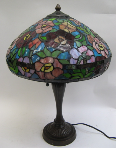 Appraisal: A STAINED AND LEADED GLASS TABLE LAMP in a floral