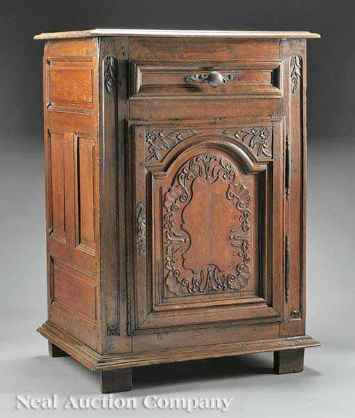 Appraisal: A French Provincial Oak Cupboard th c rectangular molded top