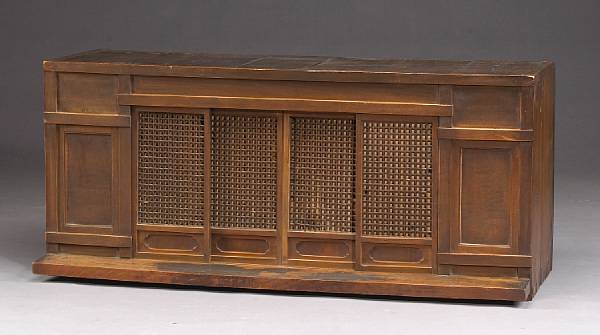 Appraisal: A mixed wood household shrine cabinet with sliding doors The