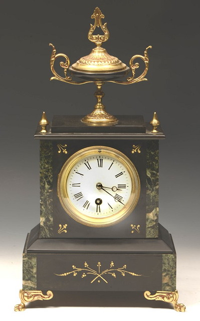 Appraisal: A VICTORIAN BLACK SLATE AND MARBLE MANTEL CLOCK with urn