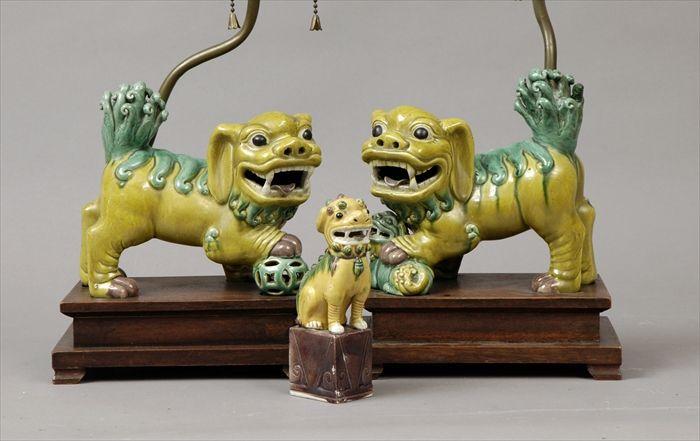 Appraisal: Pair of Chinese Yellow Green and Aubergine Enameled Porcelain Fu