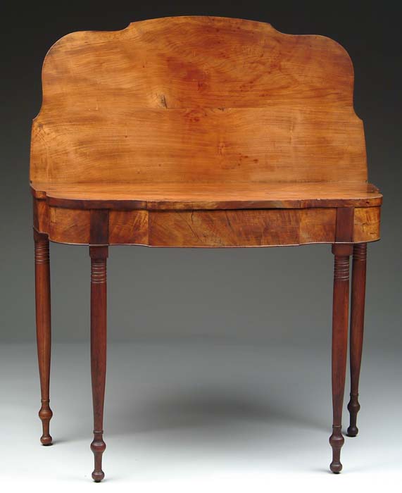 Appraisal: GOOD SHERATON CHERRY SHAPED FRONT CARD TABLE The shaped top