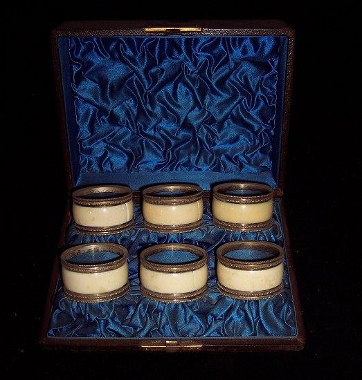 Appraisal: Six ivory napkin rings with plated mounts in a fitted