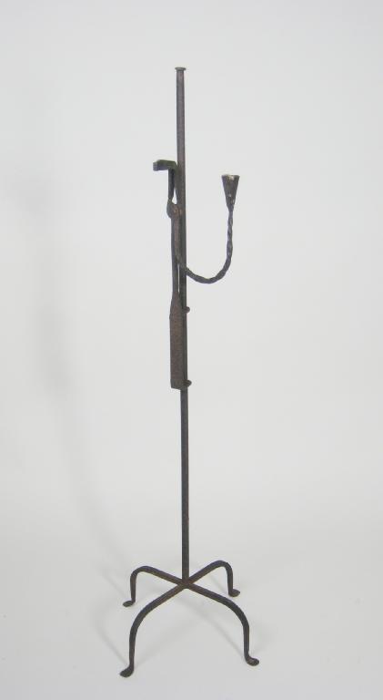 Appraisal: An antique floor standing Rushlight with twisted detail on four