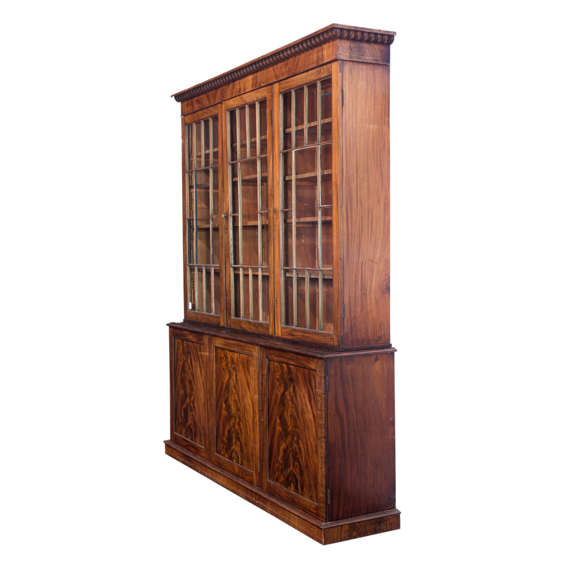 Appraisal: A GEORGIAN MAHOGANY THREE DOOR BREAKFRONT BOOKCASE A Georgian mahogany