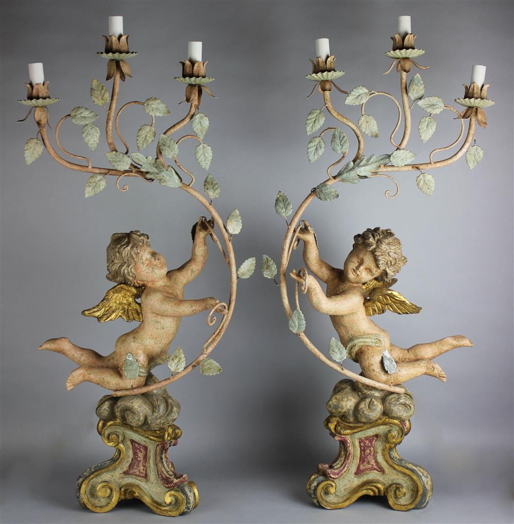 Appraisal: PAIR OF PAINTED AND GILTWOOD CHERUBS probably th Century each