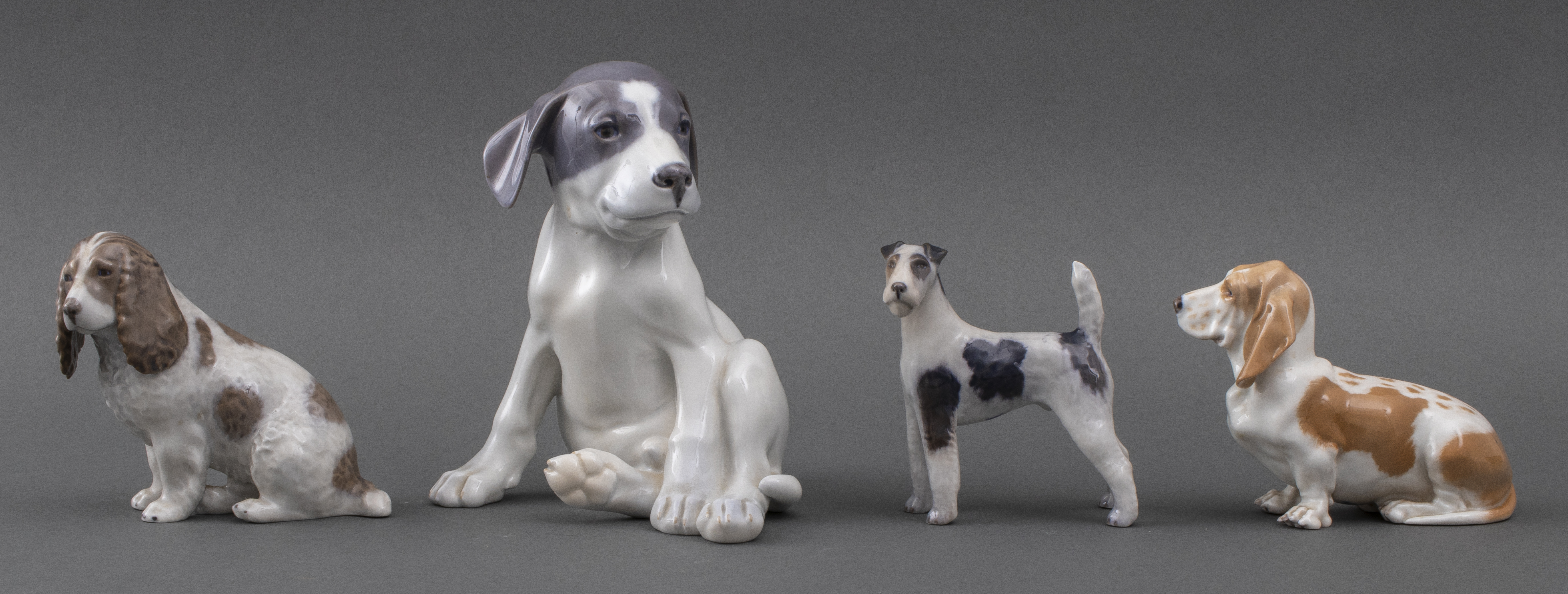 Appraisal: ROYAL COPENHAGEN PORCELAIN DOG FIGURES Four Royal Copenhagen canine figurines