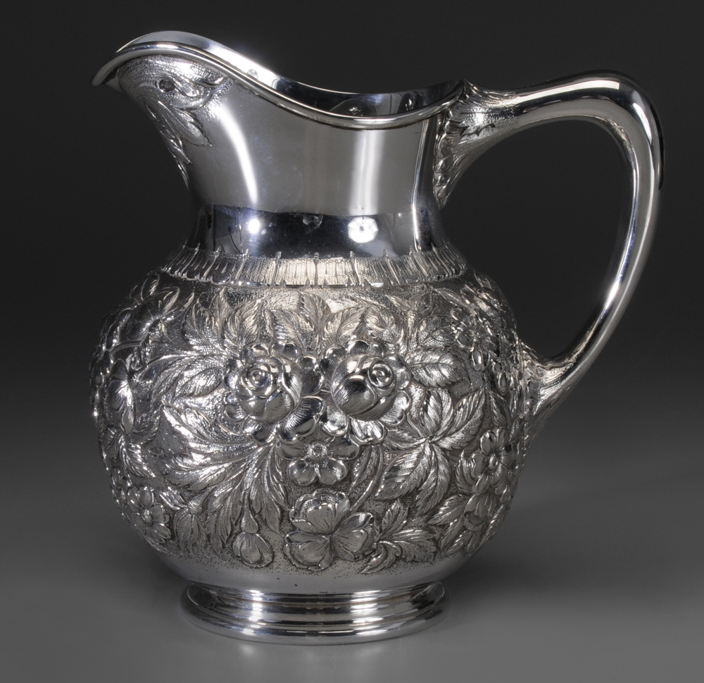 Appraisal: Kirk Repouss Sterling Water Pitcher American th century bulbous form