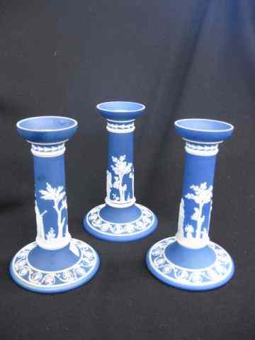 Appraisal: Wedgwood Jasperware Candlesticks dark blue classical scenes tiny rim flake