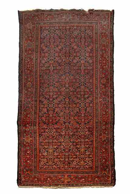 Appraisal: A HAMADAN BLUE GROUND HALL CARPET with central repeating motifs