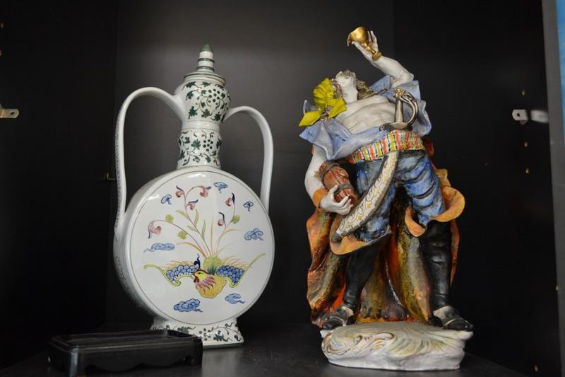 Appraisal: ITALIAN FIGURE OF A DRUNKEN SAILOR AND A DECORATIVE FLASK