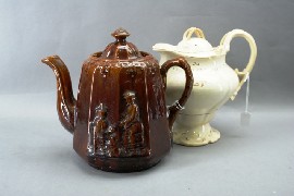 Appraisal: A th century treacle glazed tea pot relief moulded with