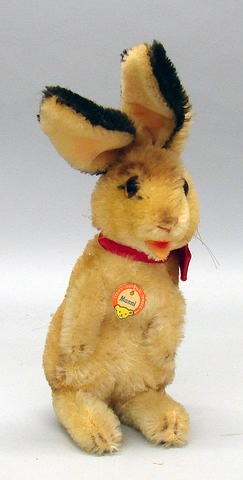 Appraisal: Mohair Manni sitting rabbit Amber glass eyes original neck ribbon