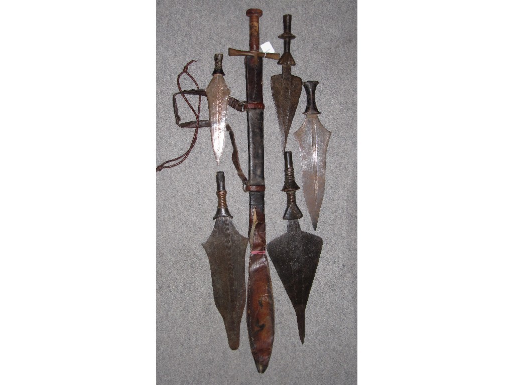 Appraisal: Lot comprising Sudanese sword in scabbard and five throwing daggers