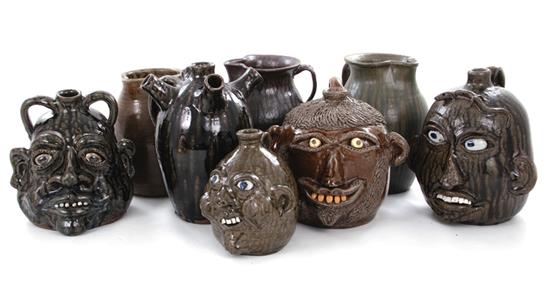 Appraisal: Howell and Meaders pottery face jugs and pitchers Howell Gillsville