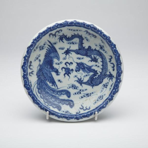 Appraisal: Blue and White Dragon and Phoenix Bowl Qianlong Mark Thickly