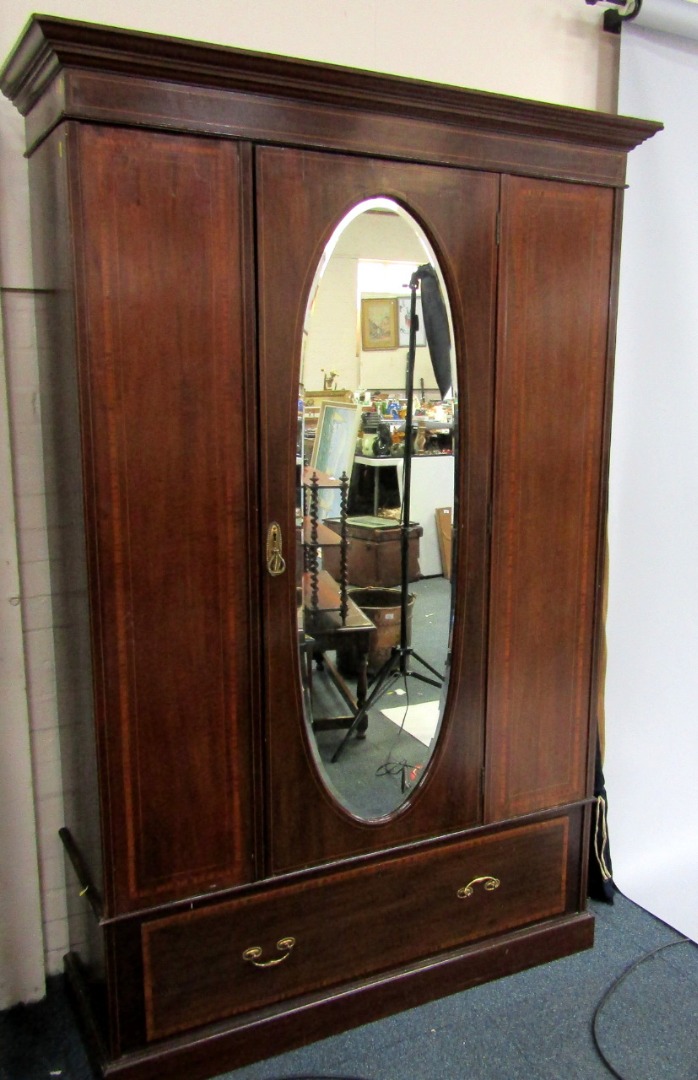 Appraisal: An Edwardian mahogany and satinwood cross banded double wardrobe the