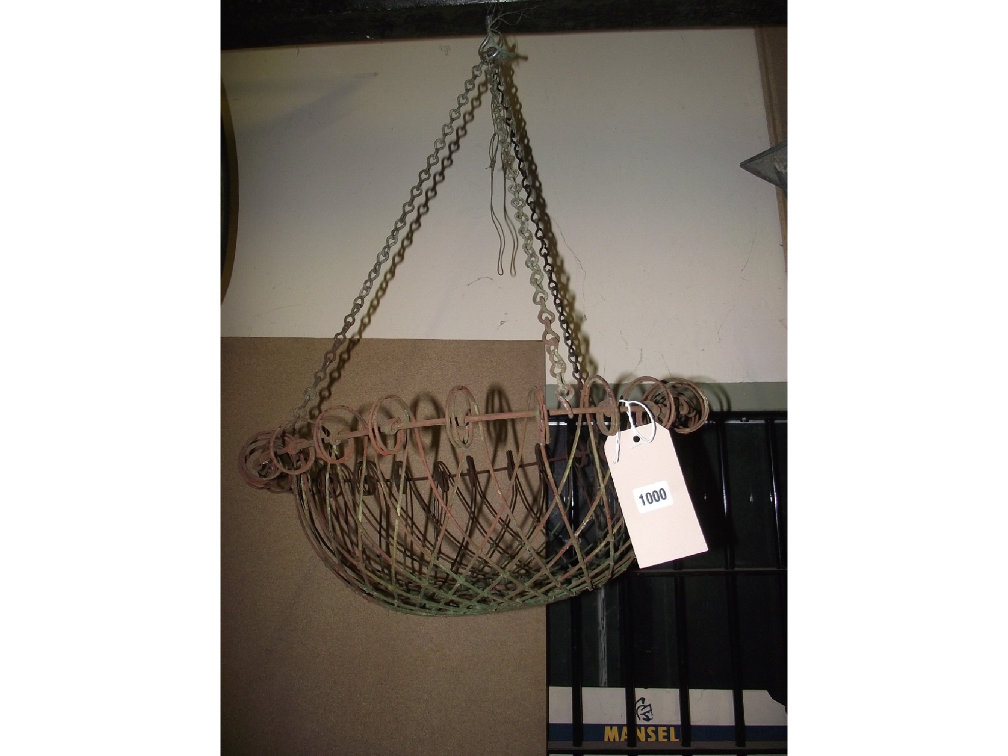 Appraisal: A vintage wirework hanging basket with lattice and simple scroll