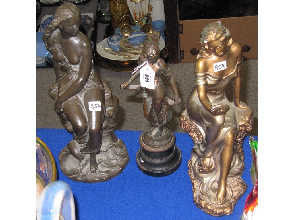 Appraisal: Three cast metal figures of ladies