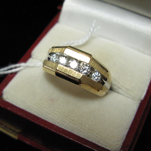 Appraisal: MAN'S DIAMOND AND FOURTEEN KARAT GOLD RING set with a