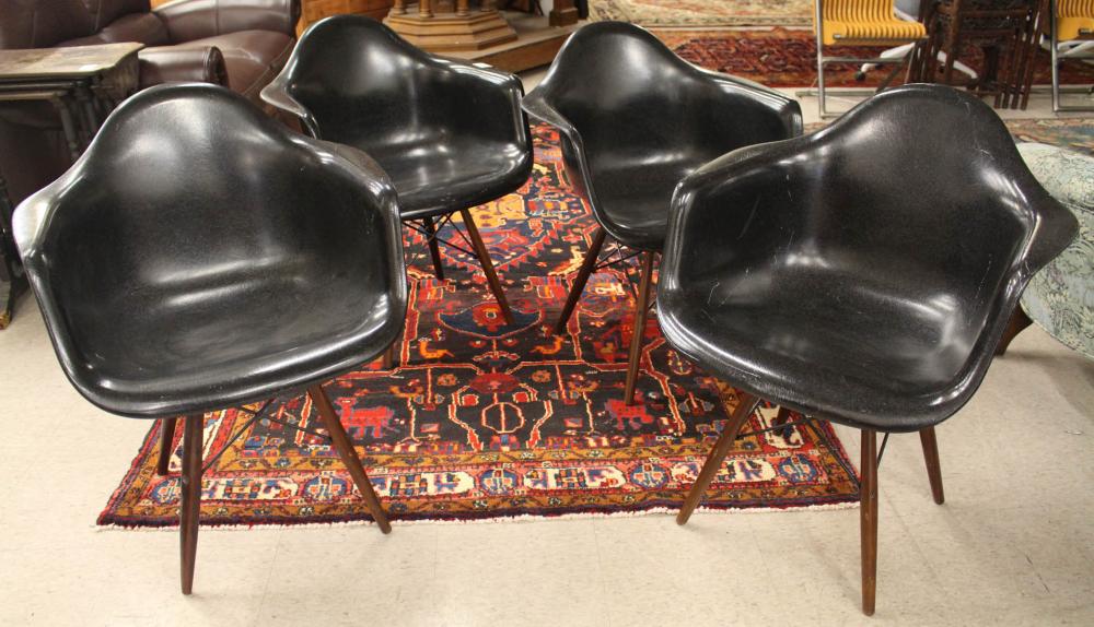 Appraisal: A SET OF FOUR BLACK 'CASE STUDY' FIBERGLASS SHELL ARMCHAIRS