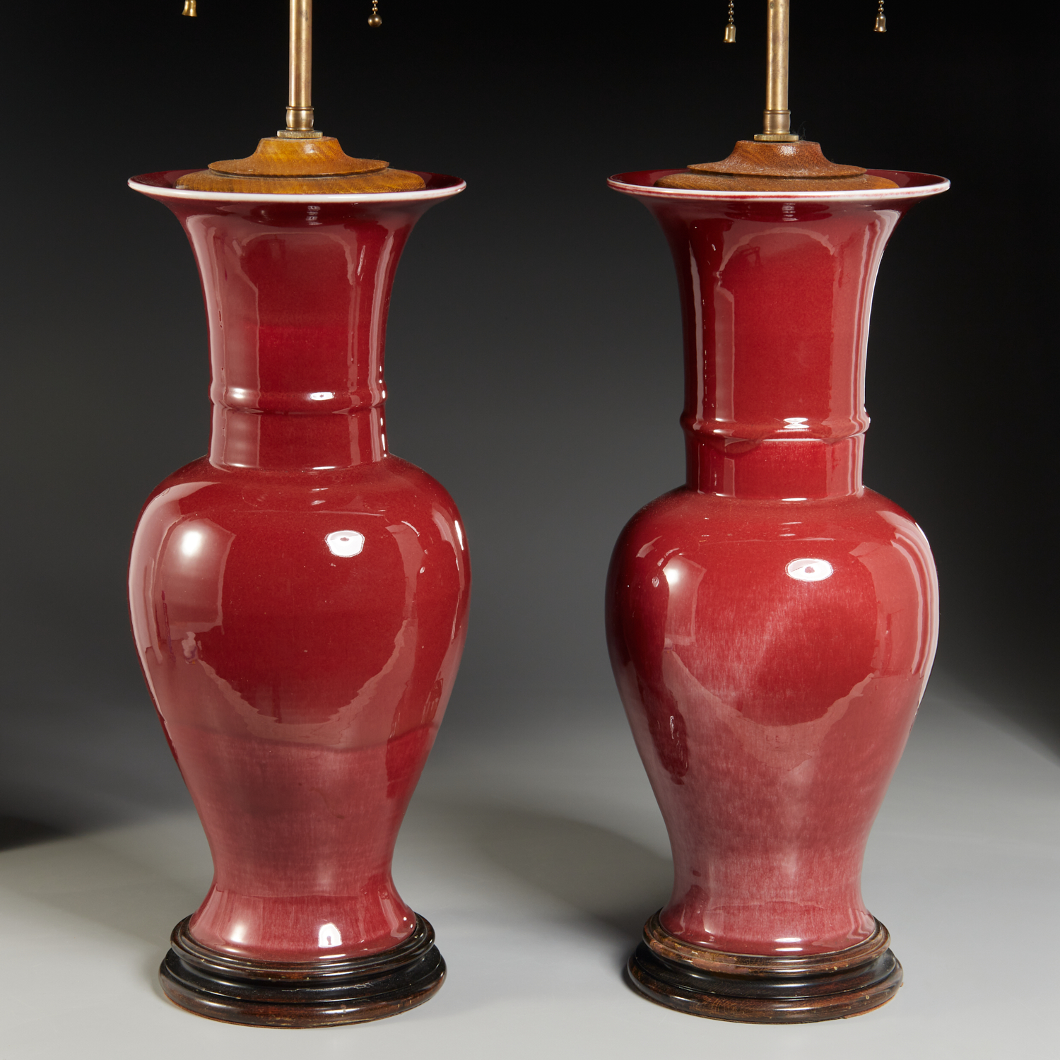 Appraisal: PAIR CHINESE OXBLOOD PHOENIX-TAIL VASE LAMPS Qing Dynasty th th