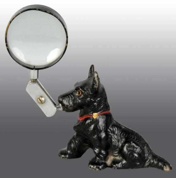 Appraisal: Cast Iron Scottie Paperweight Magnifying Glass Description Manufactured by Hubley