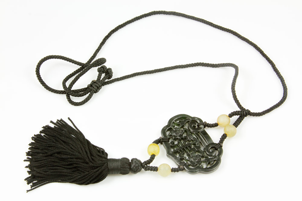 Appraisal: - Green Jade Necklace Dark green jade necklace intricately carved