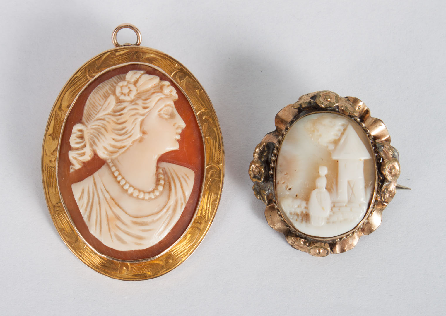 Appraisal: Two yellow gold shell cameo pins the larger marked K