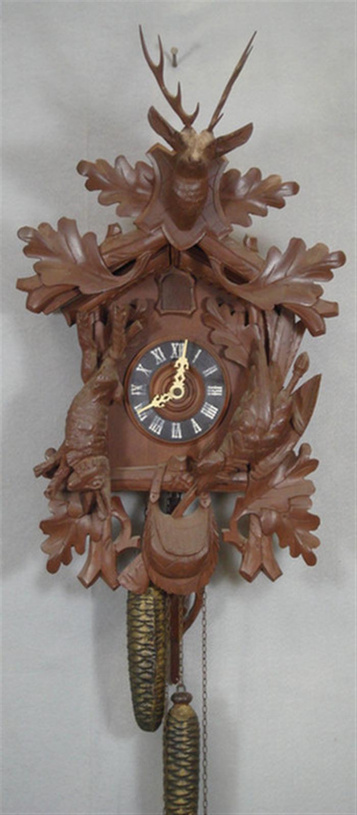 Appraisal: Carved Black Forest cuckoo clock deer head hanging game oak