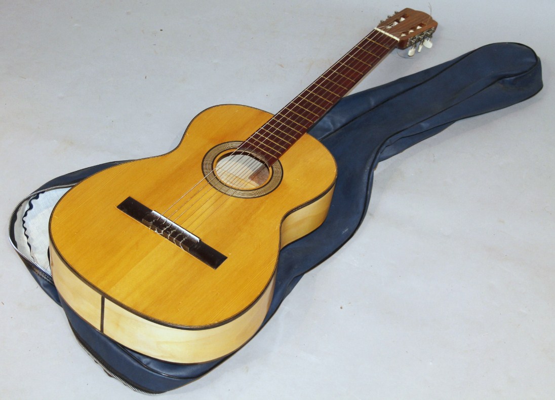 Appraisal: A modern Spanish acoustic guitar the shaped body with chrome