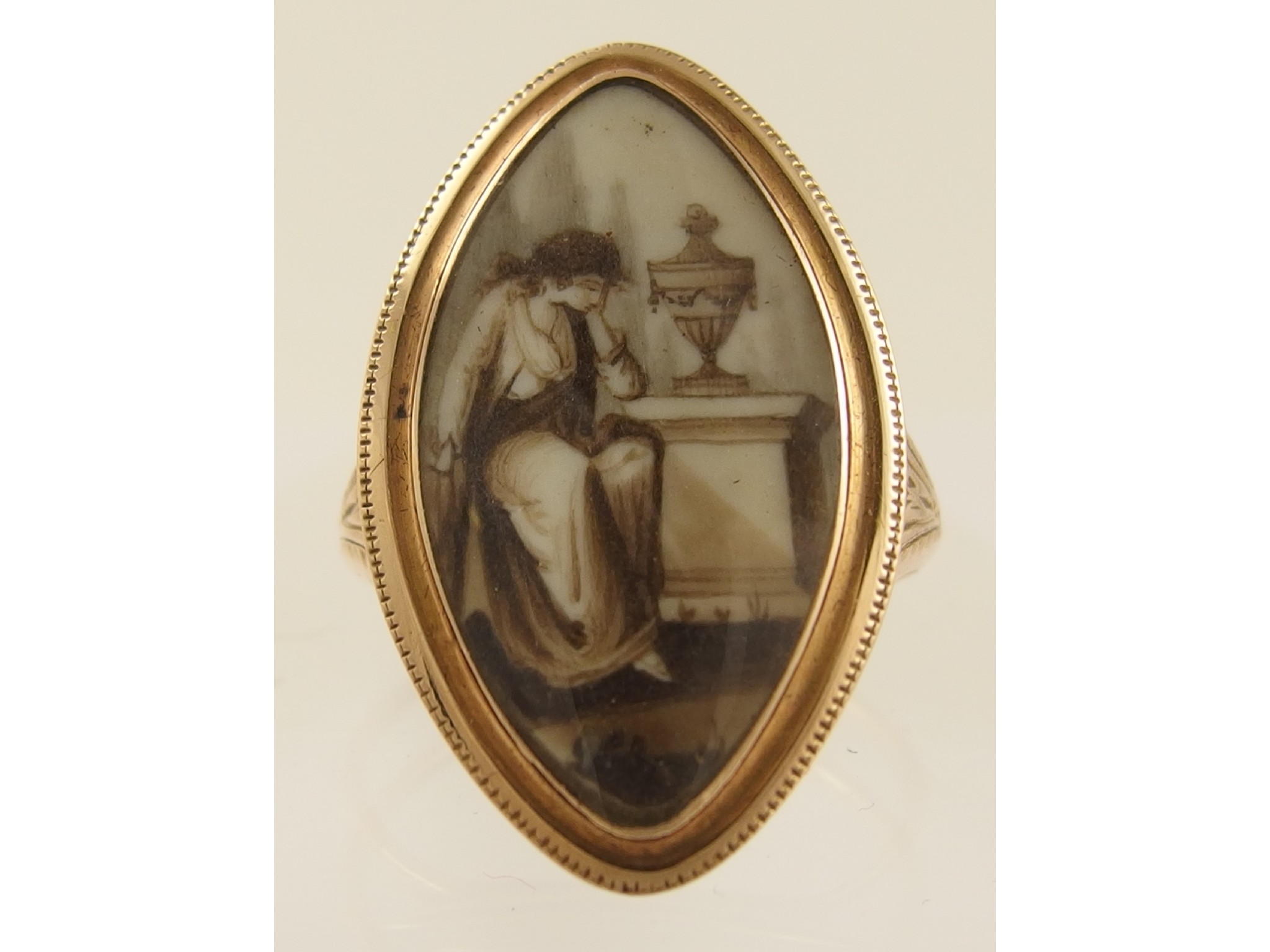 Appraisal: A Georgian painted plaque miniature mourning ringof a mournful maiden