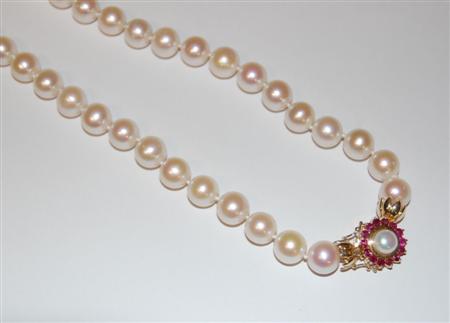 Appraisal: A cultured pearl necklace with ruby set clasp composed of