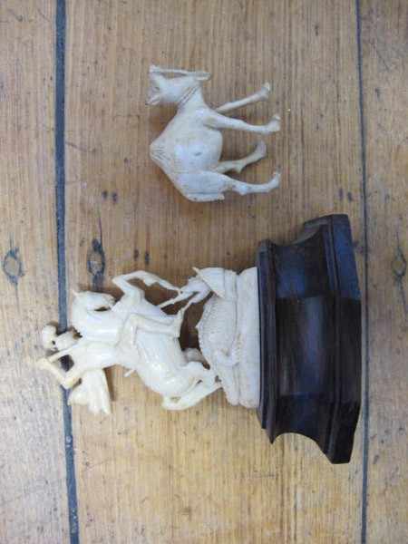 Appraisal: IVORY CARVED FIGURE OF ST GEORGE SLAYING THE DRAGON AND